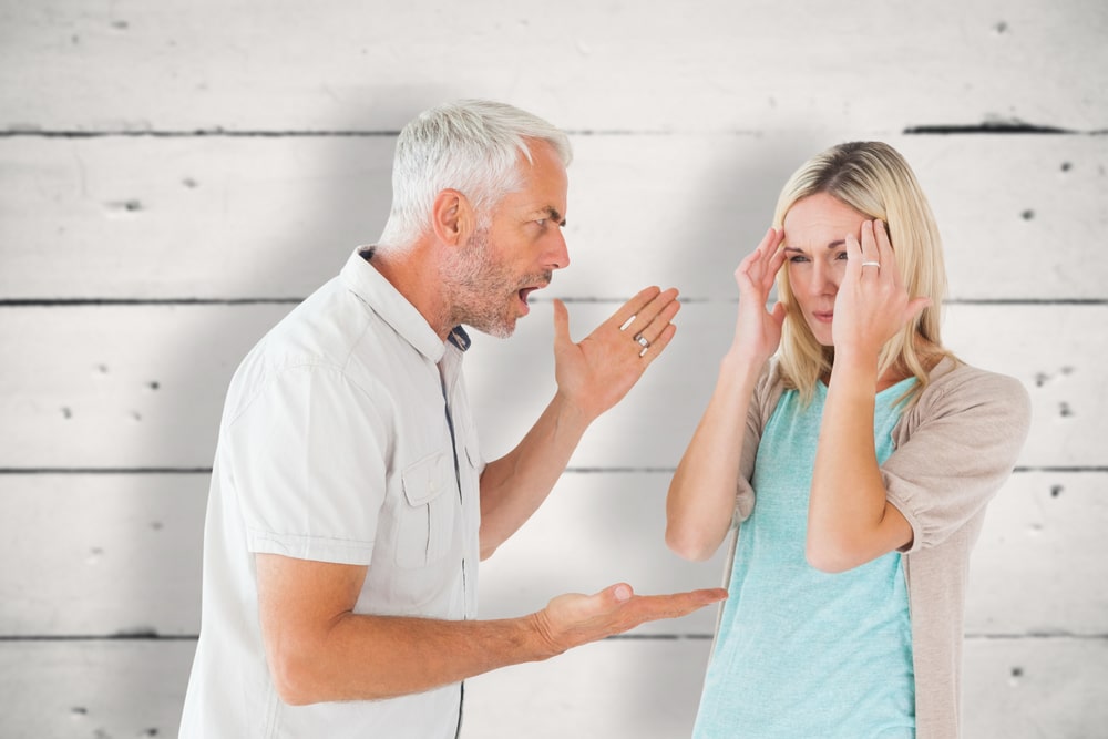 Angry husband talking to wife