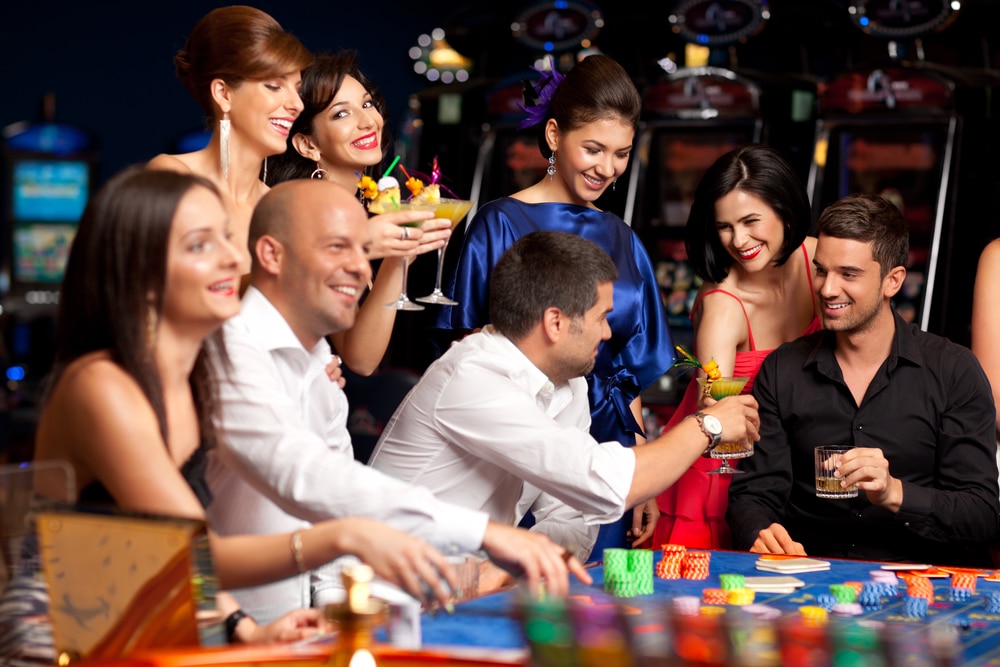 Couple playing poker with friends