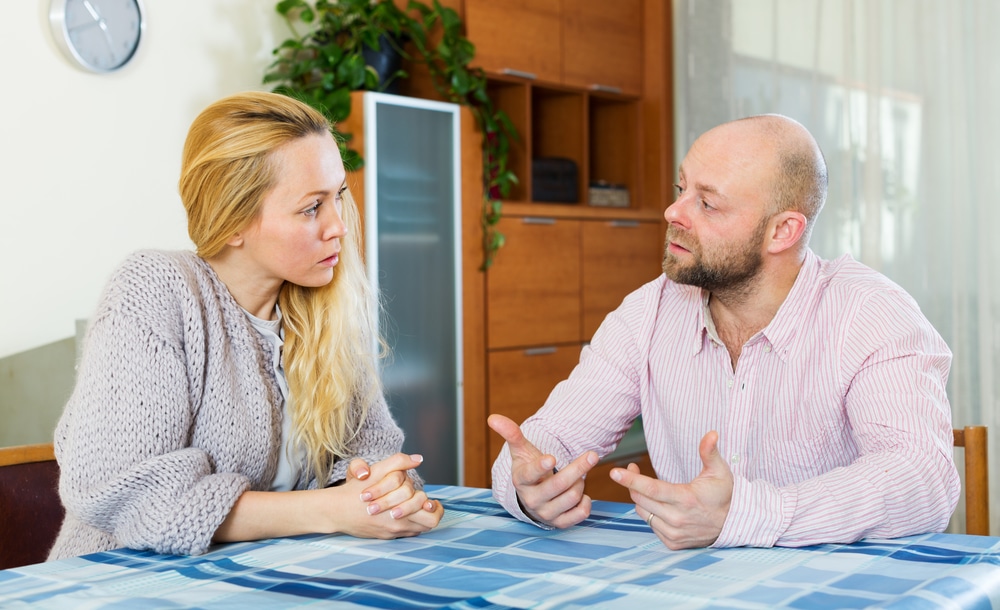 Serious couple talking