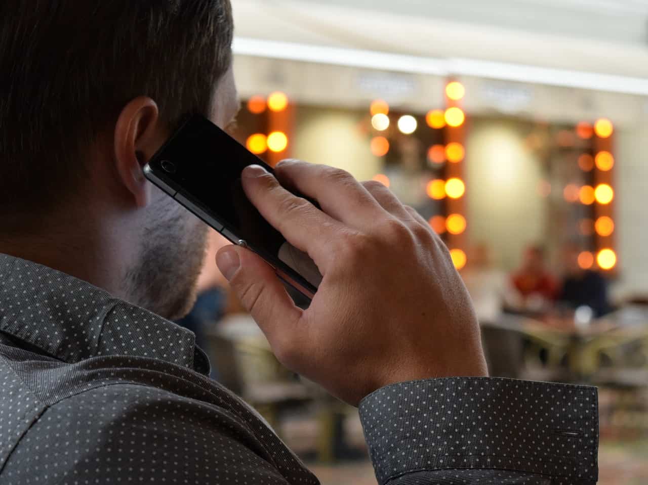 A man holding a cell phone to his ear