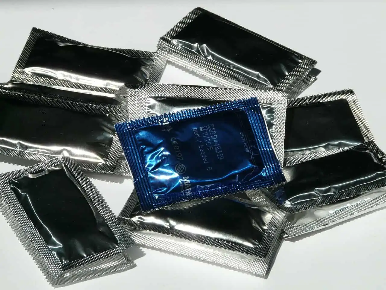 A group of silver foil packets sitting on top of each other