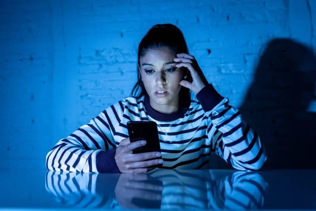 Frustrated Woman Checking Her Phone