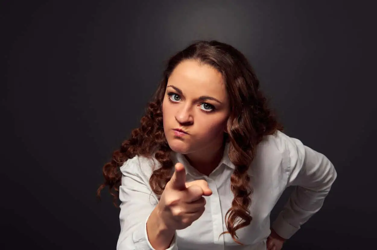 Woman being firm pointing out her finger