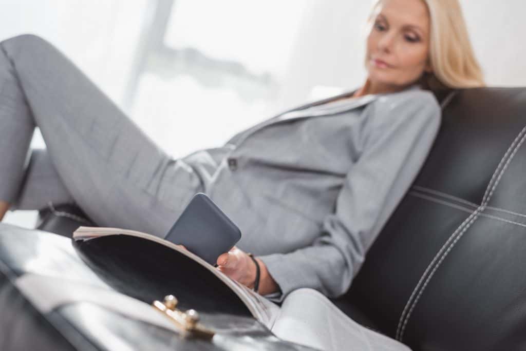 Businesswoman Sitting Holding Her Phone