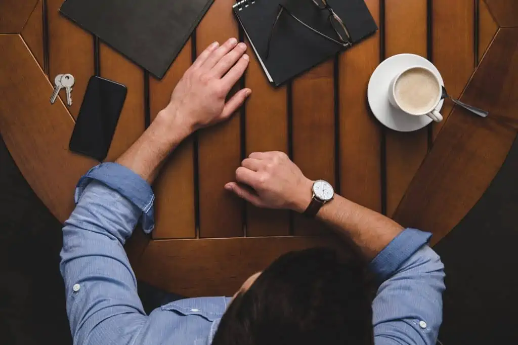 Man With His Things On The Table