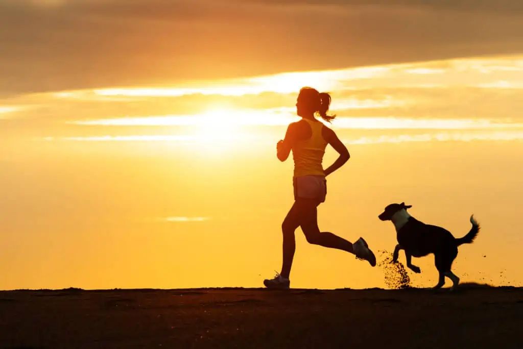 Woman jogging with her dog