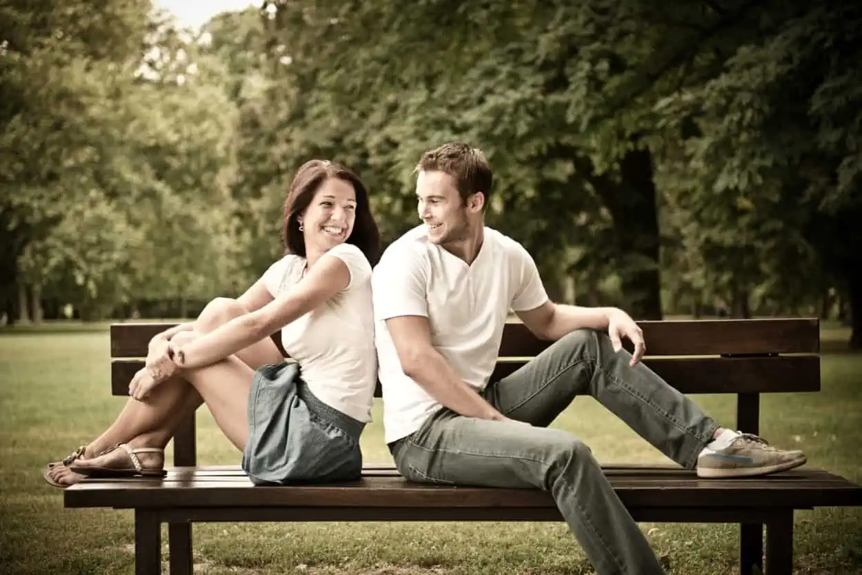 Couple sitting on a bench in the park