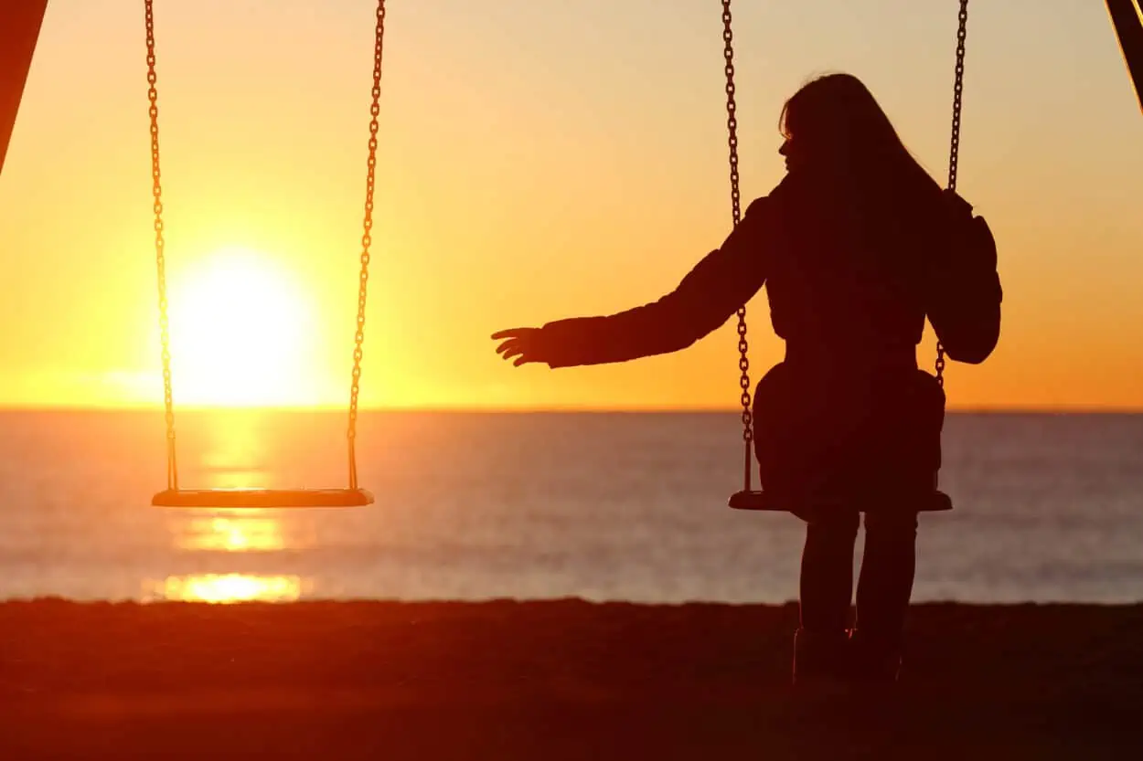 Lonely woman on a swing