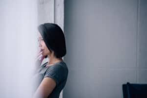 Sad woman by a window