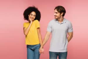 Happy couple holding hands