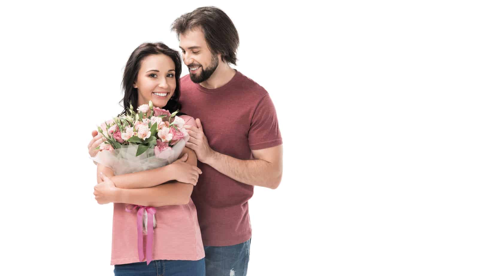 A man holding a bouquet of flowers next to a woman