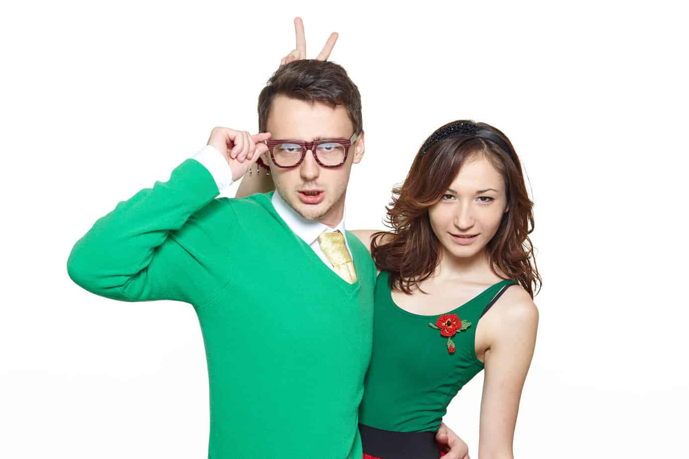 A man in a green suit and a woman in a red dress
