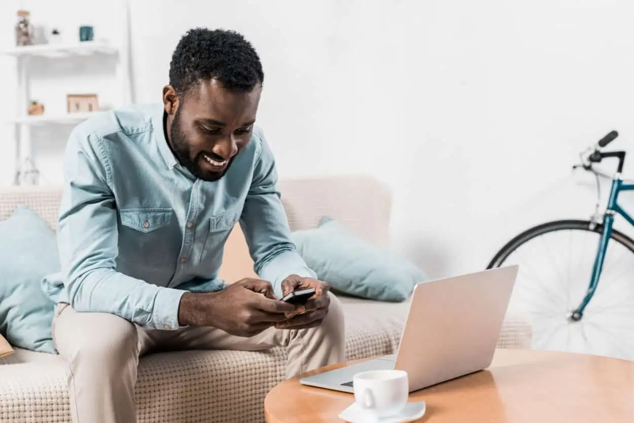 Guy texting while working