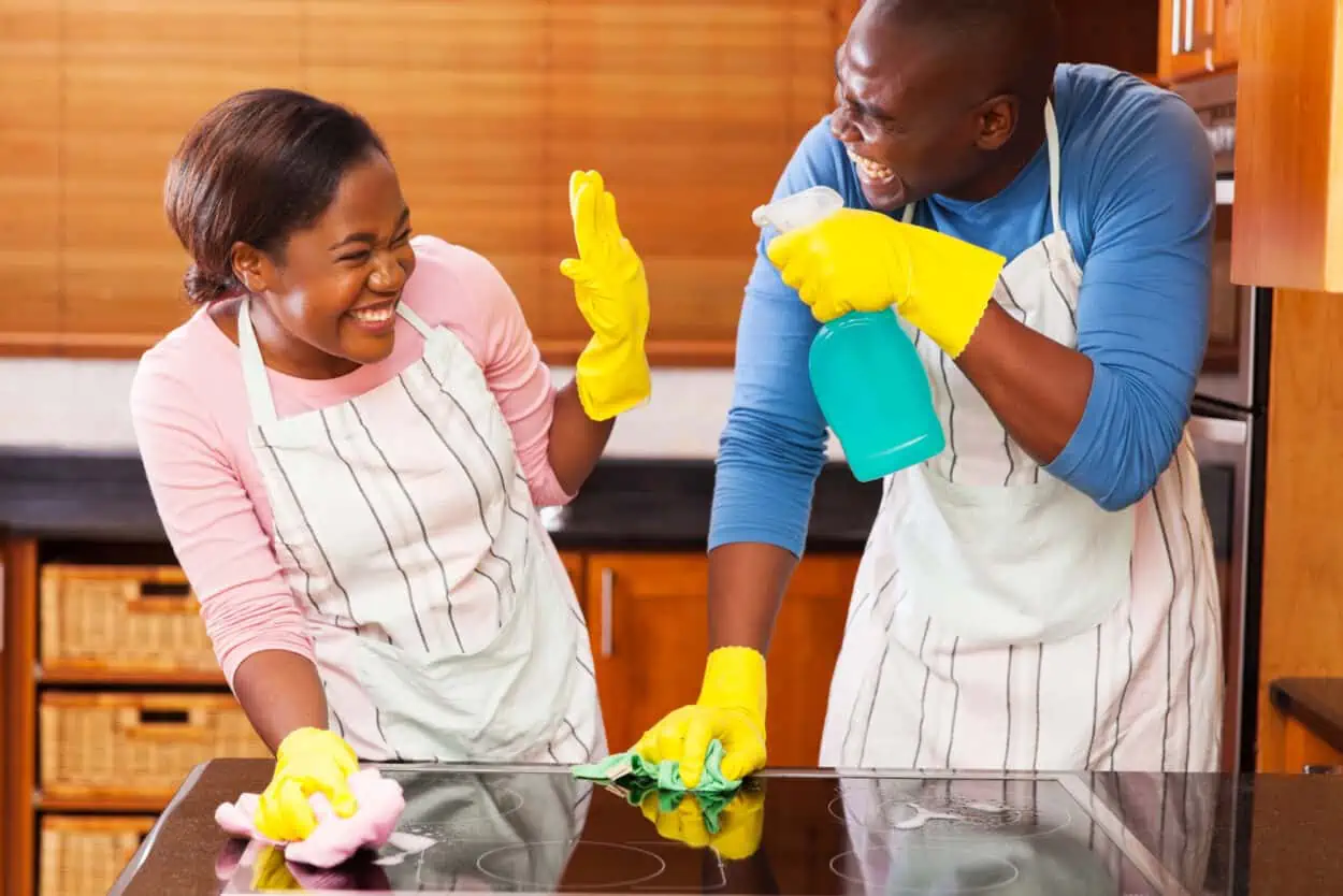 Couple having fun cleaning together