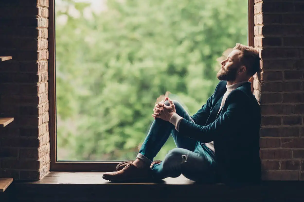 Man looking out the window