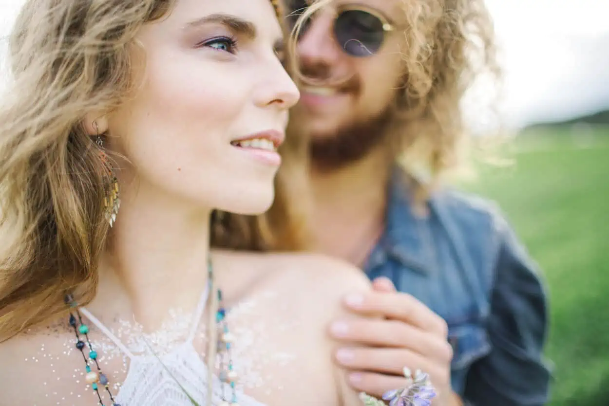 Couple smiling out in the field