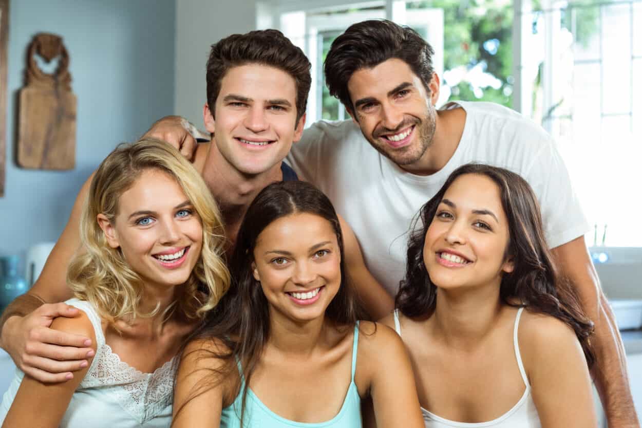 Group of friends smiling taking a photo