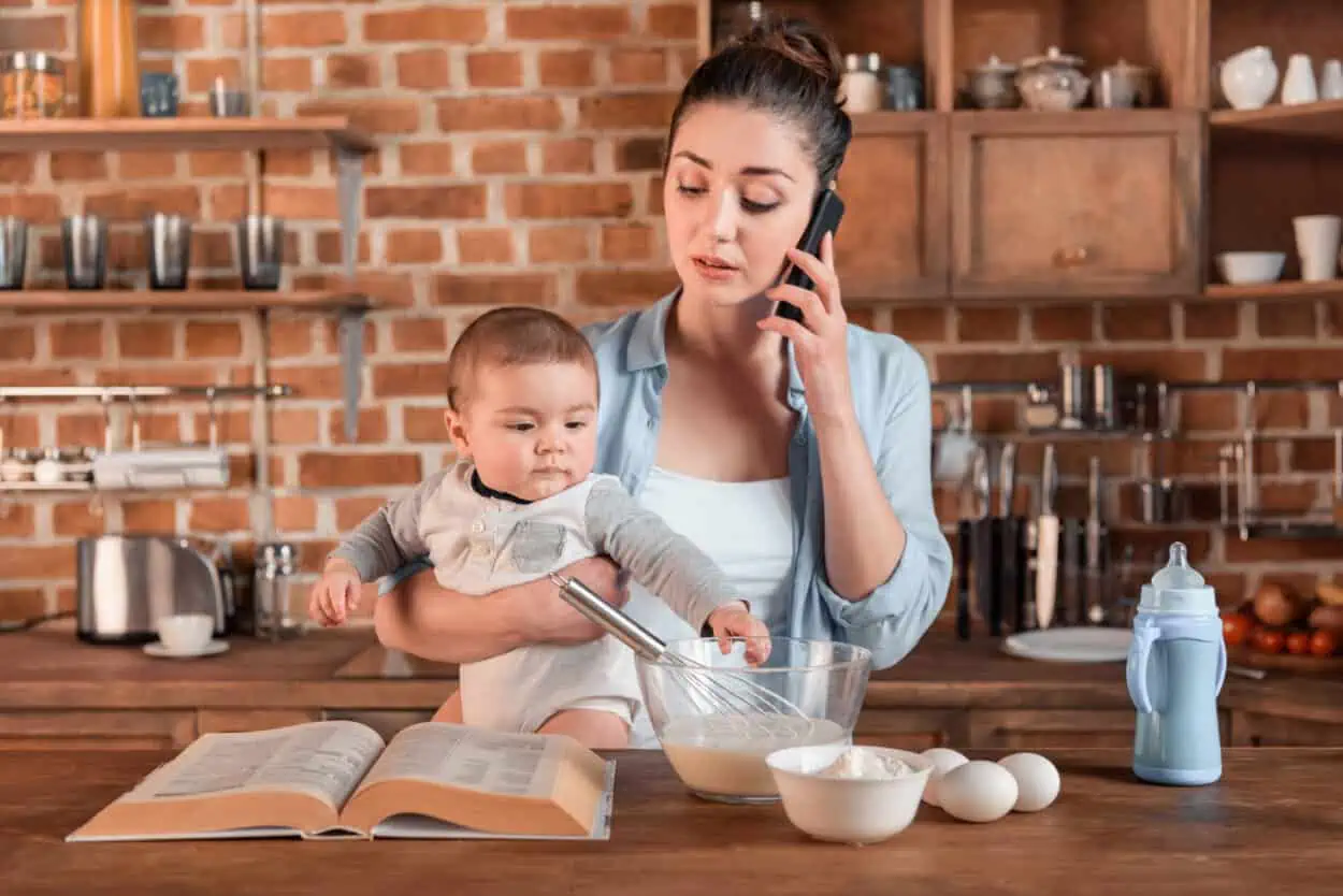 Woman on the phone holding her baby