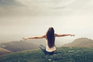 Woman stretching her arms wide